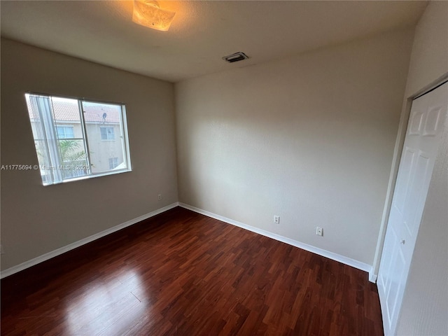 100 SW 15th Ave, Homestead, FL 33030 - unfurnished room with dark wood-style floors and baseboards