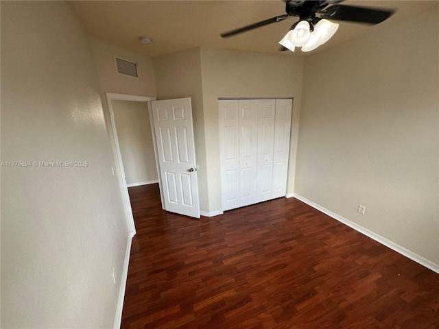 100 SW 15th Ave, Homestead, FL 33030 - unfurnished bedroom featuring dark wood finished floors, baseboards, a closet, and a ceiling fan