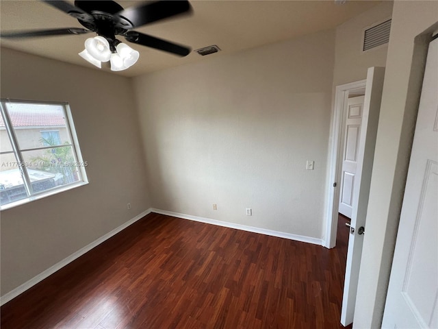 100 SW 15th Ave, Homestead, FL 33030 - spare room featuring dark wood-style floors, baseboards, and a ceiling fan