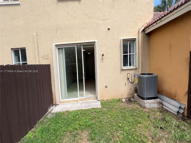 100 SW 15th Ave, Homestead, FL 33030 - rear view of property featuring central AC unit and stucco siding