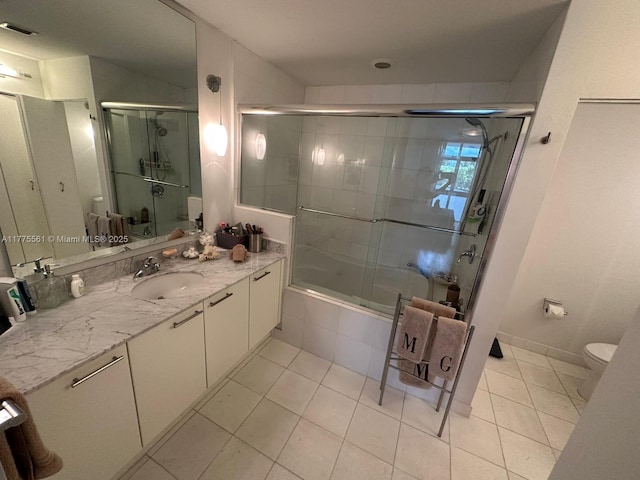 bathroom featuring tile patterned flooring, tiled shower / bath, visible vents, and toilet