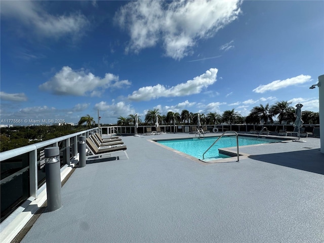 community pool with a patio