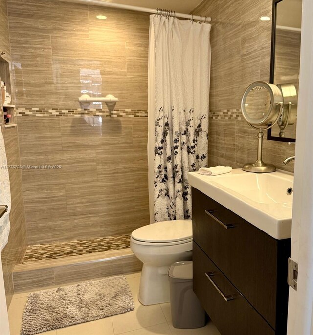 1901 Brickell Ave Unit B804, Miami, FL 33129 - bathroom featuring tile patterned floors, vanity, toilet, and tiled shower