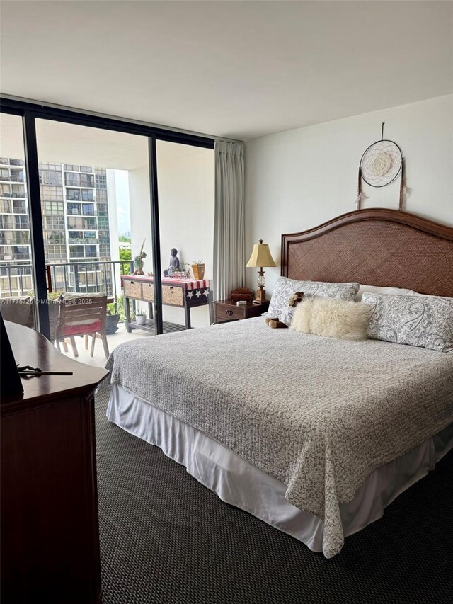 1901 Brickell Ave Unit B804, Miami, FL 33129 - bedroom featuring a wall of windows and access to exterior
