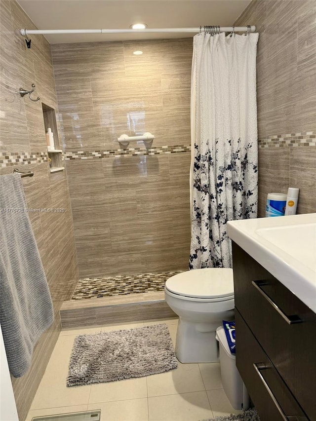 1901 Brickell Ave Unit B804, Miami, FL 33129 - full bath with tile patterned flooring, a tile shower, vanity, and tile walls
