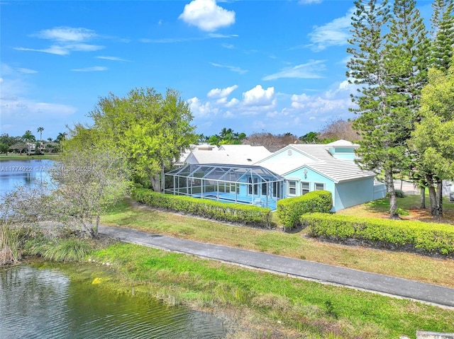 aerial view of property and surrounding area featuring a large body of water