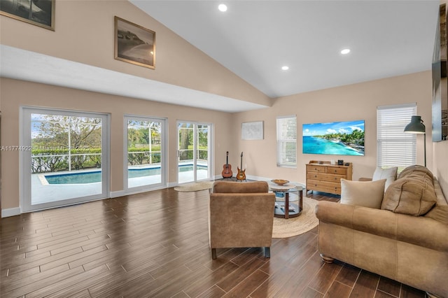 living room with recessed lighting, dark wood-style floors, baseboards, and high vaulted ceiling
