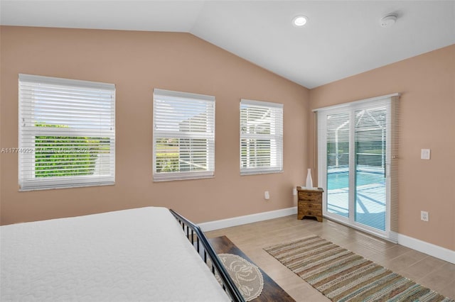 bedroom with vaulted ceiling, light wood-style floors, baseboards, and recessed lighting