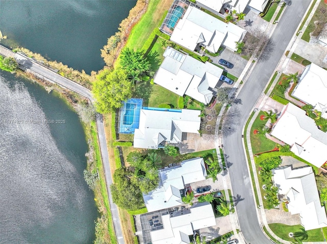 aerial perspective of suburban area with a large body of water