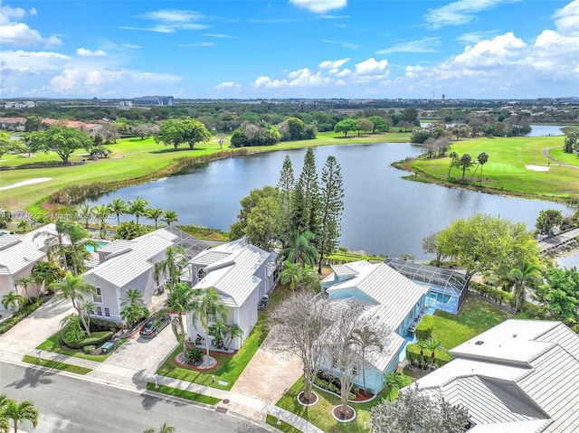 aerial view of residential area with a large body of water and a golf course