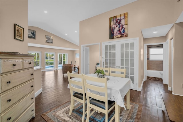 dining room with french doors, vaulted ceiling, baseboards, dark wood-style floors, and recessed lighting