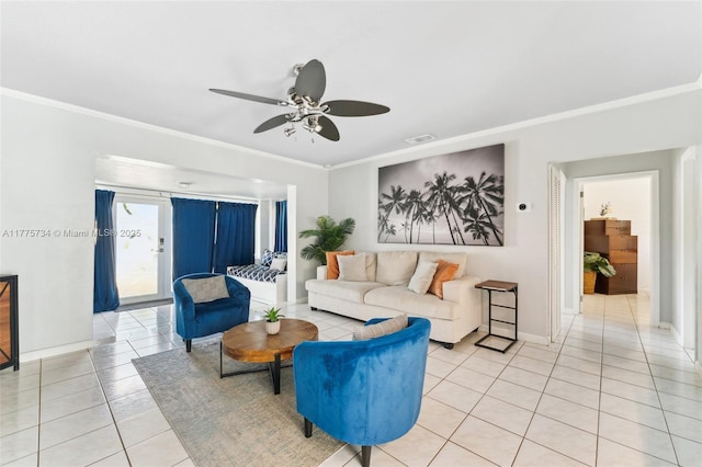 living room featuring visible vents, a ceiling fan, light tile patterned floors, crown molding, and baseboards