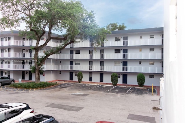 447 NE 195th St Unit 217, Miami, FL 33179 - view of apartment building / complex with uncovered parking