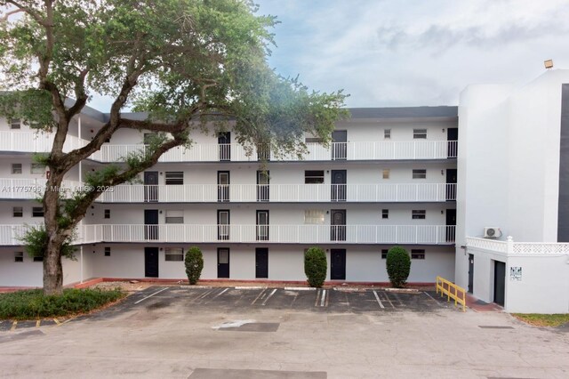 447 NE 195th St Unit 217, Miami, FL 33179 - view of apartment building / complex with uncovered parking