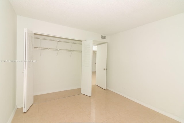 447 NE 195th St Unit 217, Miami, FL 33179 - unfurnished bedroom with a closet and baseboards