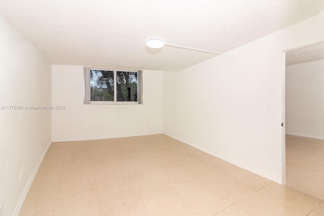 447 NE 195th St Unit 217, Miami, FL 33179 - empty room with a textured ceiling