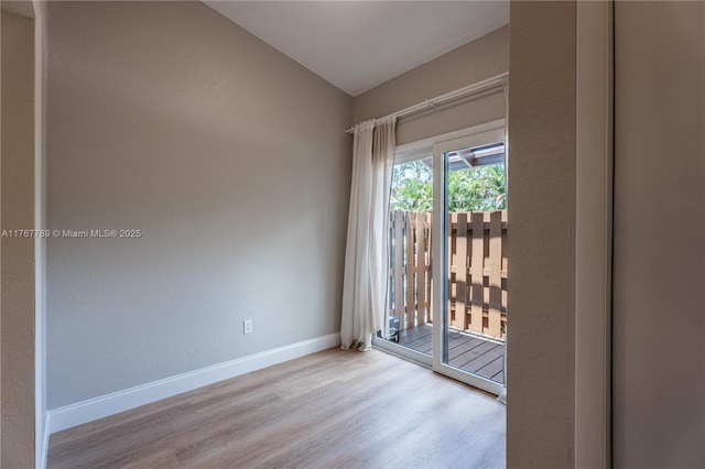 4291 S Pine Island Rd, Davie, FL 33328 - unfurnished room featuring wood finished floors and vaulted ceiling