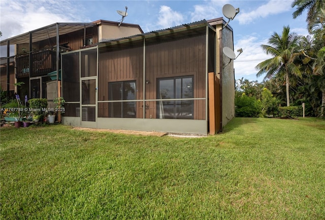 4291 S Pine Island Rd, Davie, FL 33328 - back of house featuring a lawn