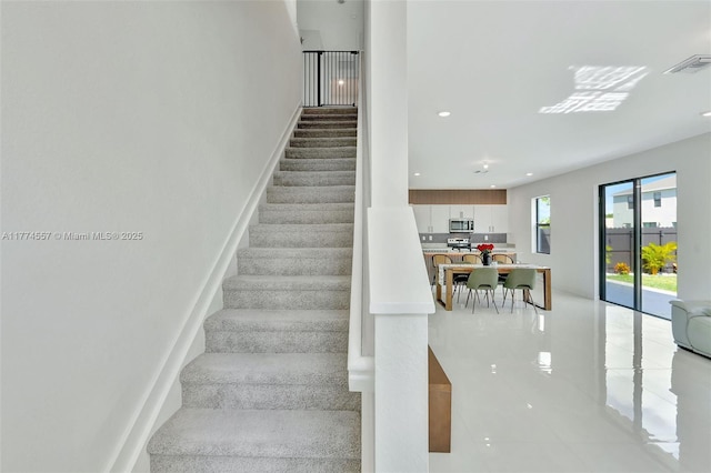 12973SW 266th Ter, Homestead, FL 33032 - stairs featuring tile patterned floors and recessed lighting