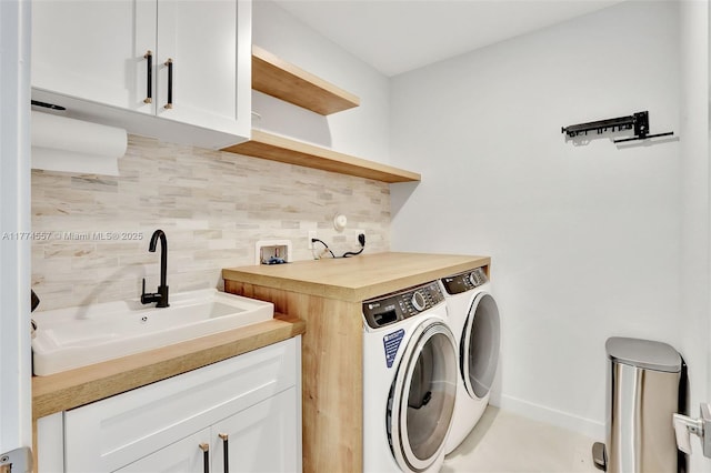 12973SW 266th Ter, Homestead, FL 33032 - laundry room featuring cabinet space, washer and dryer, and baseboards