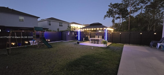 12973SW 266th Ter, Homestead, FL 33032 - view of yard featuring a gazebo, a patio area, and a playground