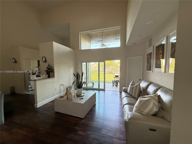 16339 Malibu Dr Unit 22, Weston, FL 33326 - living area featuring dark wood-style flooring, a textured wall, a high ceiling, visible vents, and a ceiling fan