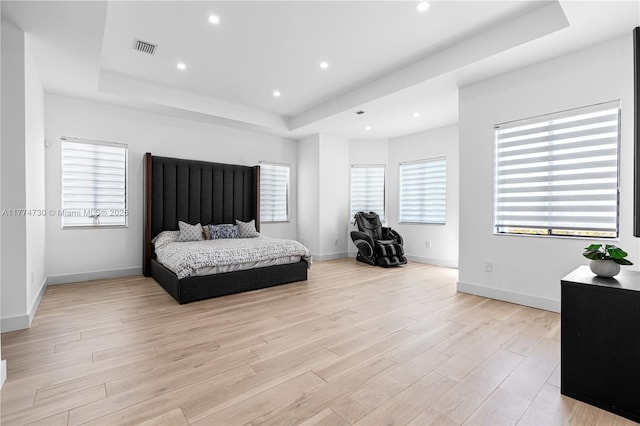 7767 SW 188th St, Cutler Bay, FL 33157 - bedroom featuring a tray ceiling, light wood-type flooring, recessed lighting, and baseboards