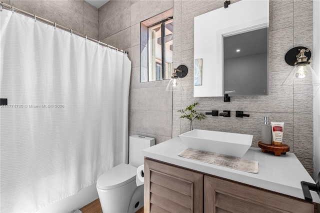 7767 SW 188th St, Cutler Bay, FL 33157 - full bath with tile walls, vanity, toilet, shower / bath combo with shower curtain, and tasteful backsplash
