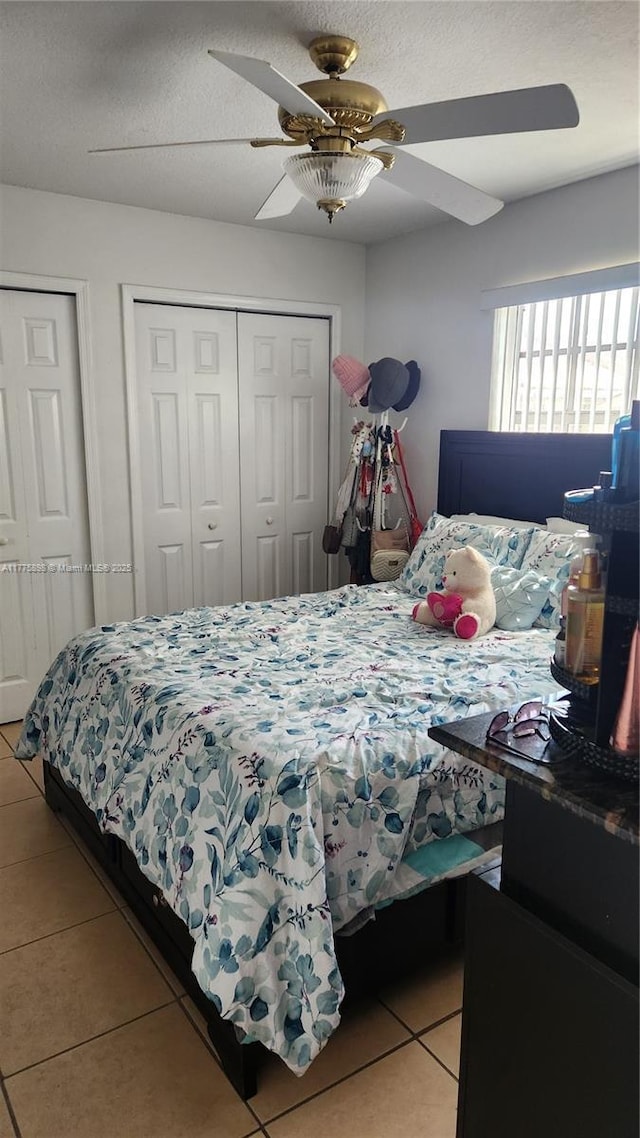 8254 SW 147th Pl, Miami, FL 33193 - bedroom featuring light tile patterned floors and a ceiling fan