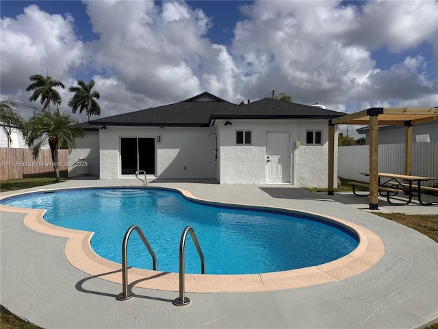 view of swimming pool with a fenced in pool, a patio area, and fence
