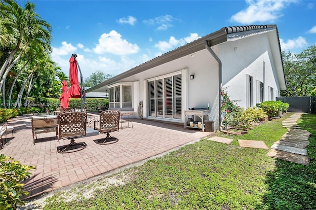 9030 SW 92nd Ct, Miami, FL 33176 - rear view of property featuring stucco siding, fence, and a patio area