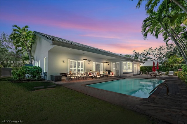 9030 SW 92nd Ct, Miami, FL 33176 - back of house with a ceiling fan, an outdoor pool, stucco siding, and a patio area