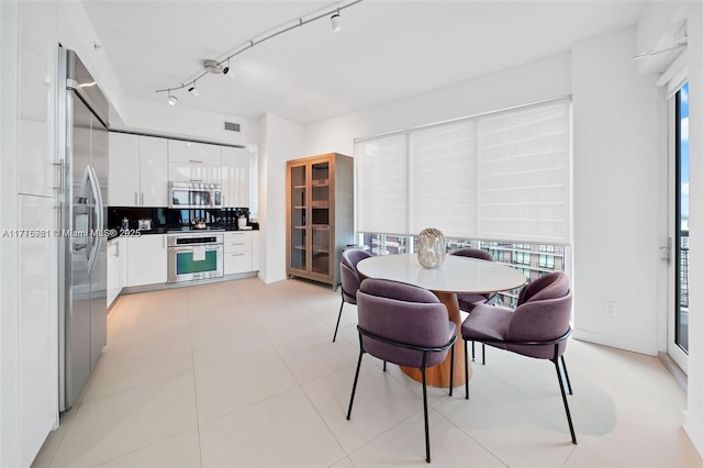 60 SW 13th St Unit 2600, Miami, FL 33130 - dining space with plenty of natural light and track lighting