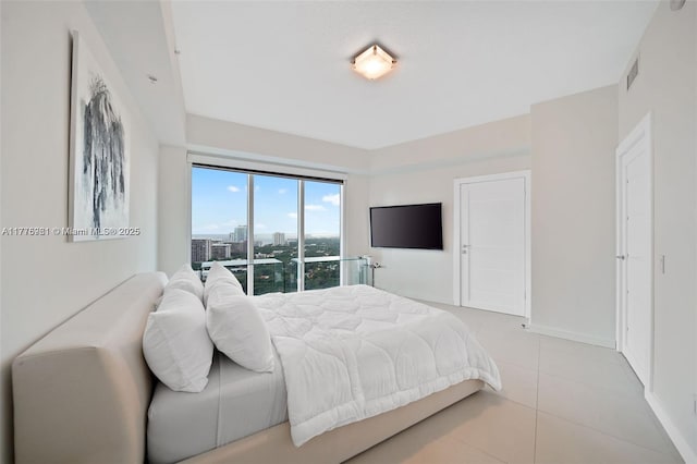 60 SW 13th St Unit 2600, Miami, FL 33130 - bedroom featuring light tile patterned flooring and baseboards