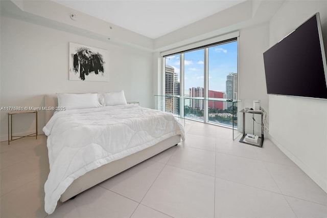 60 SW 13th St Unit 2600, Miami, FL 33130 - tiled bedroom with access to exterior and a tray ceiling