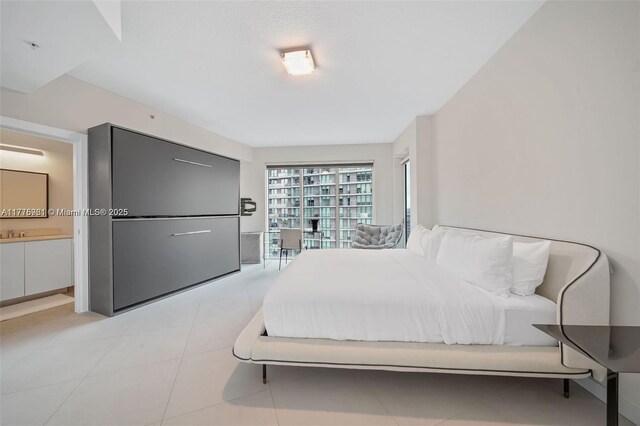 60 SW 13th St Unit 2600, Miami, FL 33130 - bedroom with light tile patterned floors