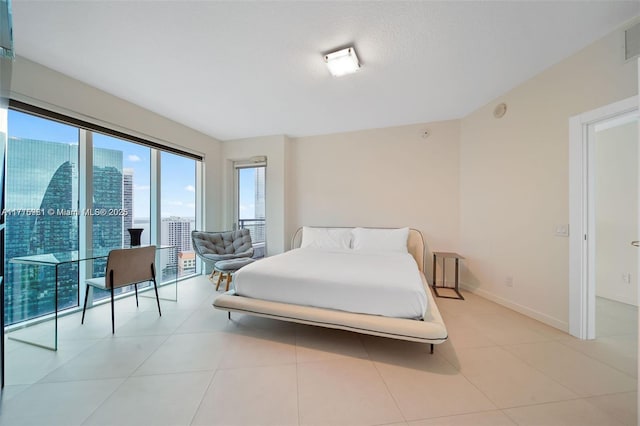 60 SW 13th St Unit 2600, Miami, FL 33130 - bedroom featuring light tile patterned flooring and baseboards