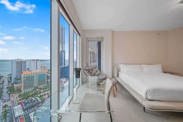 60 SW 13th St Unit 2600, Miami, FL 33130 - bedroom featuring a water view, tile patterned flooring, and a view of city