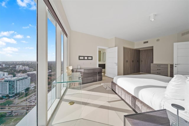 60 SW 13th St Unit 2600, Miami, FL 33130 - bedroom with tile patterned floors and a city view