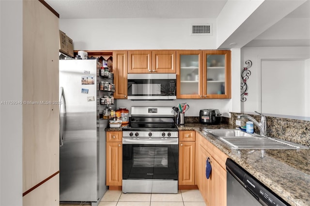1 Glen Royal Pkwy Unit 1207, Miami, FL 33125 - kitchen featuring light tile patterned flooring, visible vents, stainless steel appliances, glass insert cabinets, and a sink