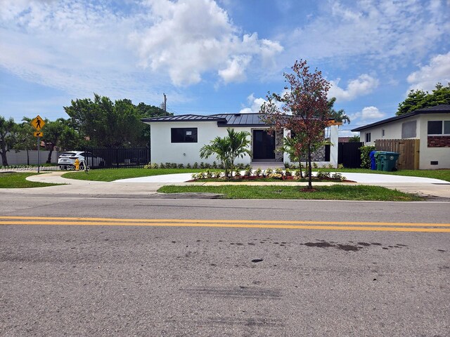 5152 SW 6th, Miami, FL 33134 - view of front of house featuring a standing seam roof, metal roof, concrete driveway, and stucco siding