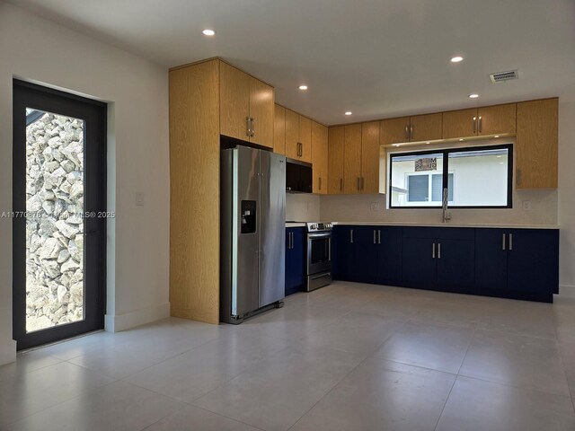 5152 SW 6th, Miami, FL 33134 - kitchen with stainless steel appliances, light countertops, recessed lighting, a sink, and light tile patterned floors