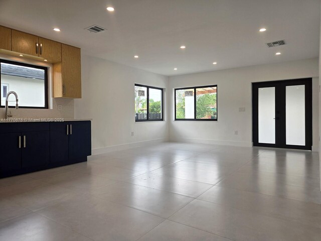 5152 SW 6th, Miami, FL 33134 - unfurnished living room with a sink, recessed lighting, and baseboards