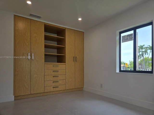 5152 SW 6th, Miami, FL 33134 - unfurnished bedroom with recessed lighting, concrete floors, baseboards, and a closet