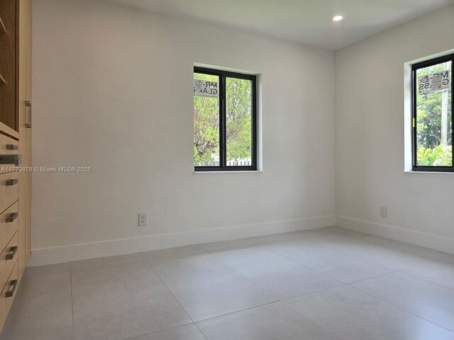 5152 SW 6th, Miami, FL 33134 - spare room featuring healthy amount of natural light, baseboards, recessed lighting, and light tile patterned floors