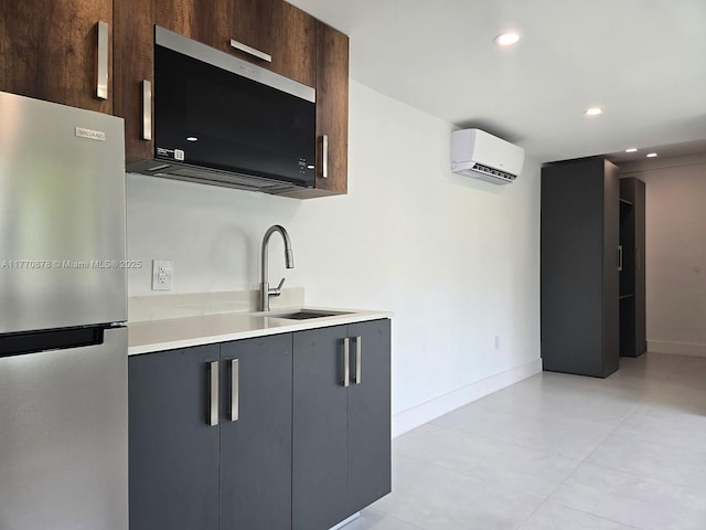5152 SW 6th, Miami, FL 33134 - kitchen with freestanding refrigerator, a sink, a wall mounted AC, light countertops, and baseboards