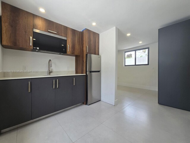 5152 SW 6th, Miami, FL 33134 - kitchen featuring appliances with stainless steel finishes, light countertops, recessed lighting, baseboards, and a sink