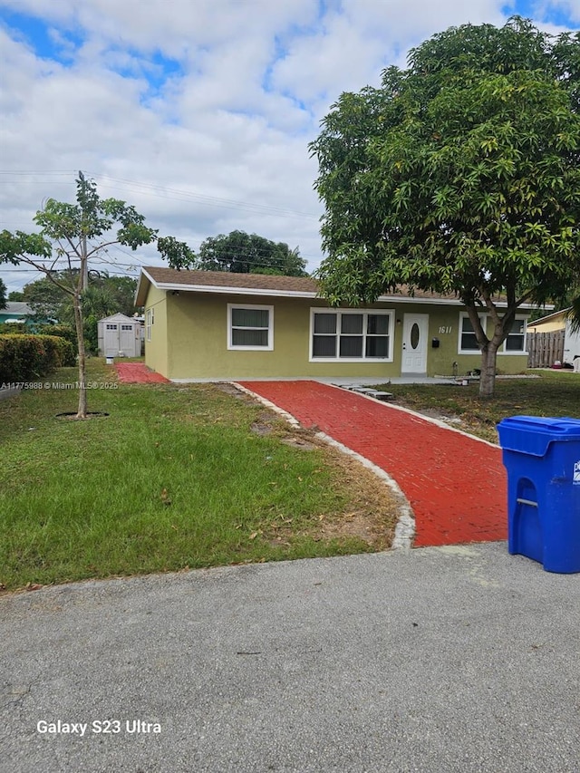 1611 NE 32nd Pl, Pompano Beach, FL 33064 - single story home with a front lawn and stucco siding