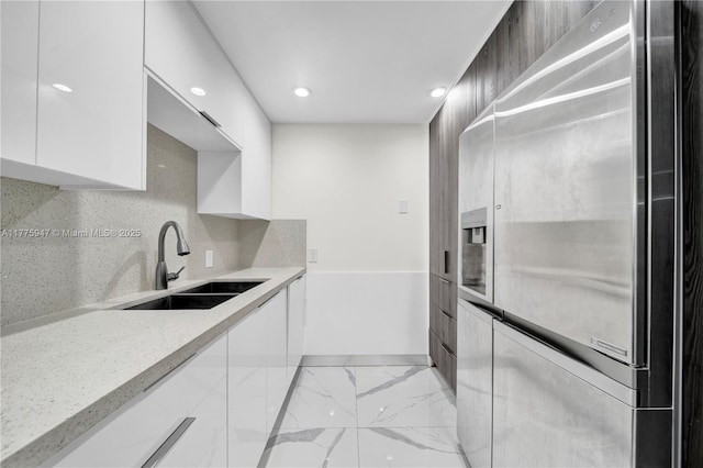 20335 W Country Club Dr Unit 2602, Aventura, FL 33180 - kitchen with white cabinets, stainless steel fridge, marble finish floor, modern cabinets, and a sink