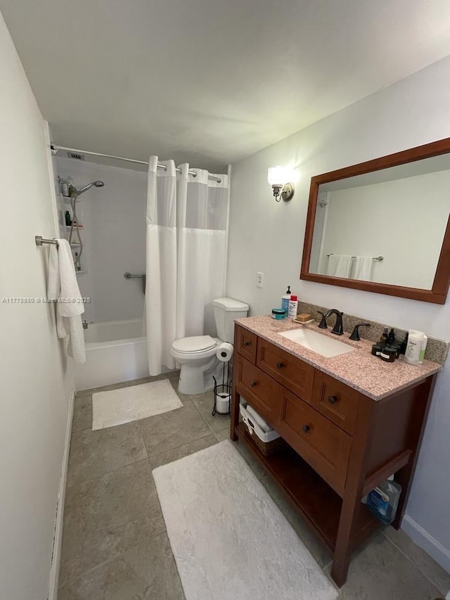 full bath featuring toilet, vanity, and shower / bath combo with shower curtain